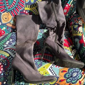 Stretch knee hi boots with three inch heels